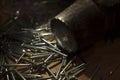 Galvanized nails and old hammer