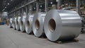 Galvanized sheet metal rolls on pallets in industrial factory setting Royalty Free Stock Photo