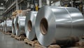 Galvanized sheet metal rolls on pallets in industrial factory setting Royalty Free Stock Photo