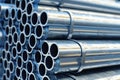 galvanized steel pipes stacked in warehouse