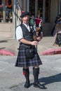 Galveston, TX/USA - 12 06 2014: Male musician in traditional Scottish costume plays harp at Dickens on the Strand Festival in Galv