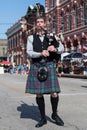 Galveston, TX/USA - 12 06 2014: Male musician in traditional Scottish costume plays harp at Dickens on the Strand Festival in Galv