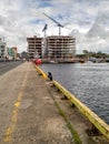 Galway city, Ireland - 09/24/2020: Fishing boats and construction site of Bonham quay building by docks area