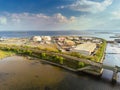 Galway city, Ireland - 21.04.2021: Port commercial buildings and dock area. Aerial view, Atlantic ocean and Burren mountains in