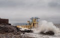 Galway - Ireland 02/28/2020: Blackrock public diving board hit by powerful waves before storm Jorge. Salthill