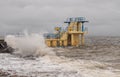 Galway - Ireland 02/28/2020: Blackrock public diving board hit by powerful waves before storm Jorge. Salthill