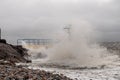 Galway - Ireland 02/28/2020: Blackrock public diving board hit by powerful waves before storm Jorge. Salthill