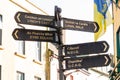 Galway, Ireland 03.01.2021- Direction sign on shop street with town main tourist attraction landmarks and sights