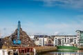 Galway, Ireland - 18.06.2021: Dock area, crane unloading metal scrap from a heavy truck