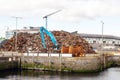 Galway, Ireland - 04.02.2021: Heap of old rusty scrap metal ready to be loaded on a ship for transportation