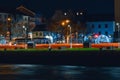 Galway, Ireland - 12.04.2021: Night scene. River Corrib and anti flood protection on river bank, Illuminated for Christmas