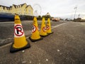 Galway, Ireland 04.17.2023: No parking yellow warning cones by Irish Garda in Salthill area. Parking problem on busy road