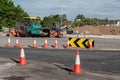 Galway, Ireland - 07.06.2021: Road work on N6 road. Heavy machinery in use. Warm sunny day. Upgrading town traffic system