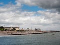 Galway / Ireland 02/20/2019 Salthill promenade, Fun fair with big wheel, cloudy sky Royalty Free Stock Photo