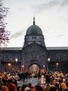 Galway, Ireland -29.10.2023: Scene at Macnas Halloween parade at Salmon Weir Bridge, Cathedral building in the background. Huge