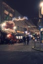 Galway, Ireland - 11.24.2021: Scene at Shop street. Christmas decorated and illuminated. Open pubs and shops