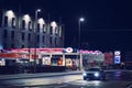 Galway, Ireland - 14.12.2022: Sweeney petrol station and City bin truck. Night shot