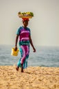 GAMBIE, BIJILO - 05 January 2020;Woman selling fruit in a basket Royalty Free Stock Photo