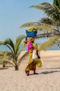 GAMBIE, BIJILO - 05 January 2020;Woman selling fruit in a basket Royalty Free Stock Photo