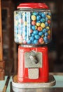 Gamble eggs in vintage gumball machine at grocery store Royalty Free Stock Photo