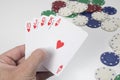 Gambler holding a winning poker hand Royalty Free Stock Photo