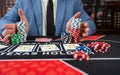 Gambler man hands pushing chips and going all-in in poker game at casino Royalty Free Stock Photo