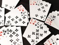 gambling card game. cards tens nines black and red diamonds worms clubs and spades on a dark background Royalty Free Stock Photo