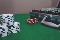 Gambling concept with suitcase poker on a green table with dices and white chips Royalty Free Stock Photo