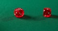 Gambling dices on green table Royalty Free Stock Photo