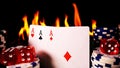 Gambling Poker Cards Money Chips and Red Dices on Fire Royalty Free Stock Photo