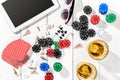 Gambling. Poker chips, cards and the dice nearby tablet on wooden table. Top view. Copyspace. Poker Royalty Free Stock Photo