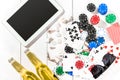 Gambling. Poker chips, cards and the dice nearby tablet on wooden table. Top view. Copyspace. Poker Royalty Free Stock Photo