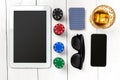 Gambling. Poker chips, cards and the dice nearby tablet on wooden table. Top view. Copyspace. Poker Royalty Free Stock Photo