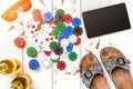 Gambling. Poker chips, cards and the dice nearby tablet on wooden table. Top view. Copyspace. Poker Royalty Free Stock Photo