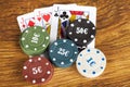 Gambling poker concept with betting chips and playing cards Royalty Free Stock Photo