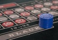 Gambling on a roulette table with blue chips Royalty Free Stock Photo