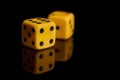 Gambling. Two dice on a black background with reflection Royalty Free Stock Photo