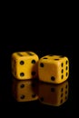 Gambling. Two dice on a black background with reflection Royalty Free Stock Photo