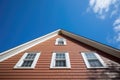 gambrel roof close-up under clear skies