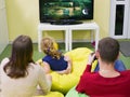 Game addiction in parents. Parents play a game console unforgiving for children