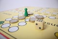Game board green figure on money with dice