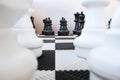 A game of chess large pieces. Chess pieces on the floor. Black and white shapes. Copy of the space. Royalty Free Stock Photo