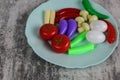 Fake food in a blue plate on a white background Royalty Free Stock Photo