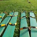 a game of clogs made of long wooden planks and rubber ropes