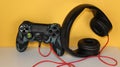 Game controller with headphone gaming background yellow