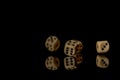 Game cubes on shiny black table with dark reflection Royalty Free Stock Photo