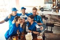 Game day fun with some our favorites. a group of friends taking a selfie while watching a sports game at a bar. Royalty Free Stock Photo