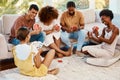 Game, happy or friends playing cards, poker or black jack at home for gambling together in a holiday party. Smile, men Royalty Free Stock Photo