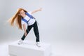 Portrait of little Caucasian girl, child posing isolated over white studio background. Little surfer Royalty Free Stock Photo