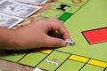 Game monopoly, game chips and dice on the table Royalty Free Stock Photo